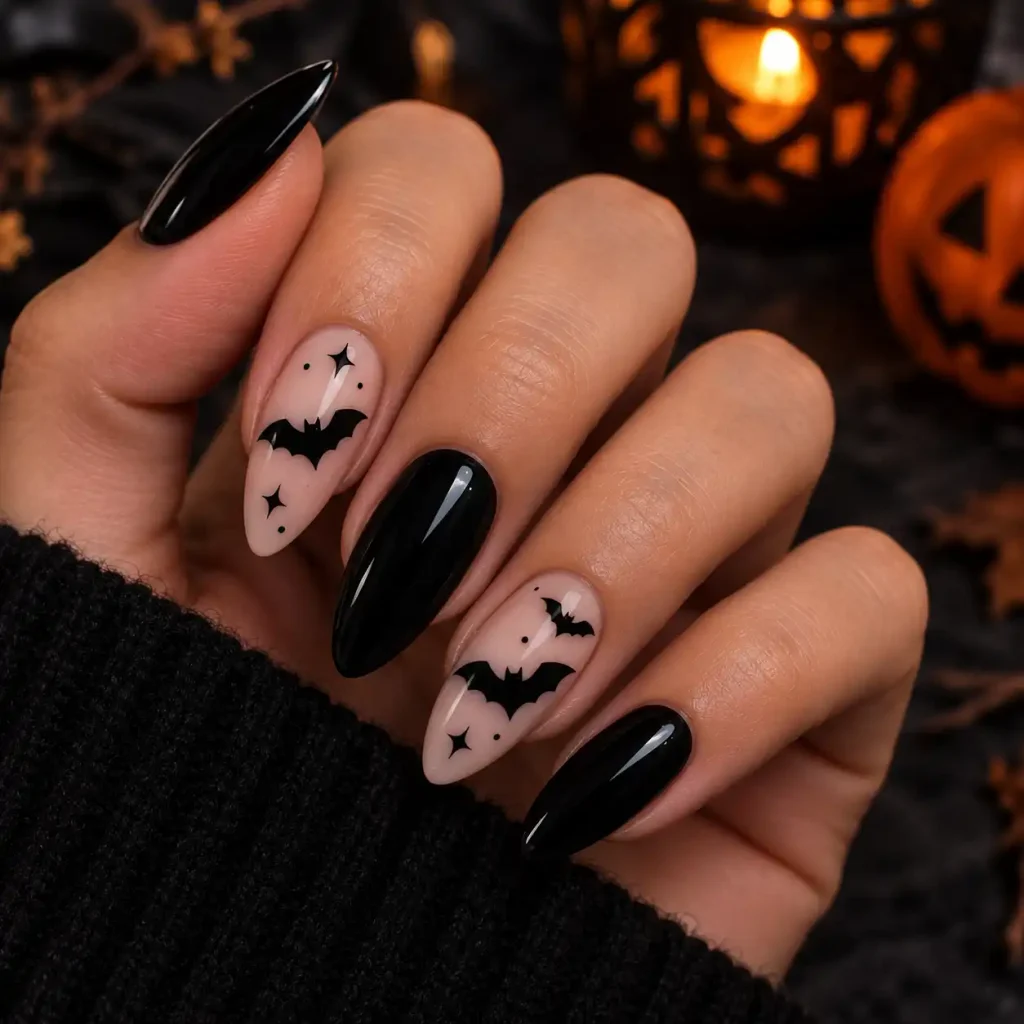 Black bat silhouette accent nail design